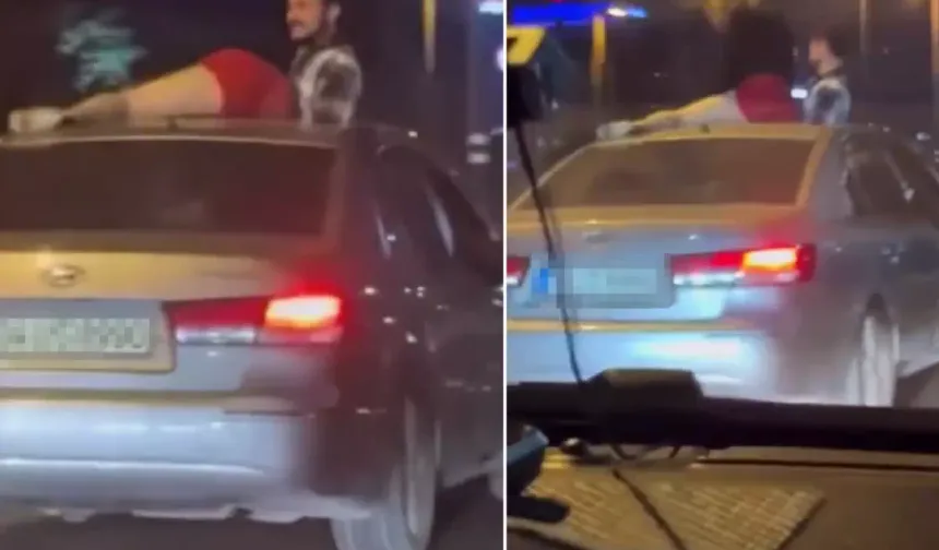 Şişli'de seyir halindeki otomobilin tavanına çıkıp dans etti