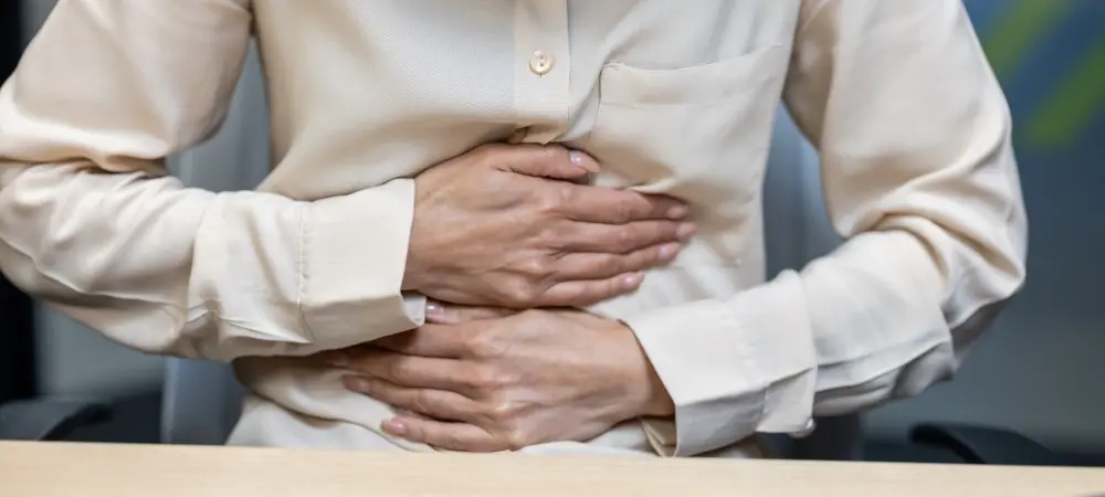 Woman In Beige Blouse Experiencing Stomach Pain Wh 2024 09 30 19 57 57 Utc 19 96669 Web Image B